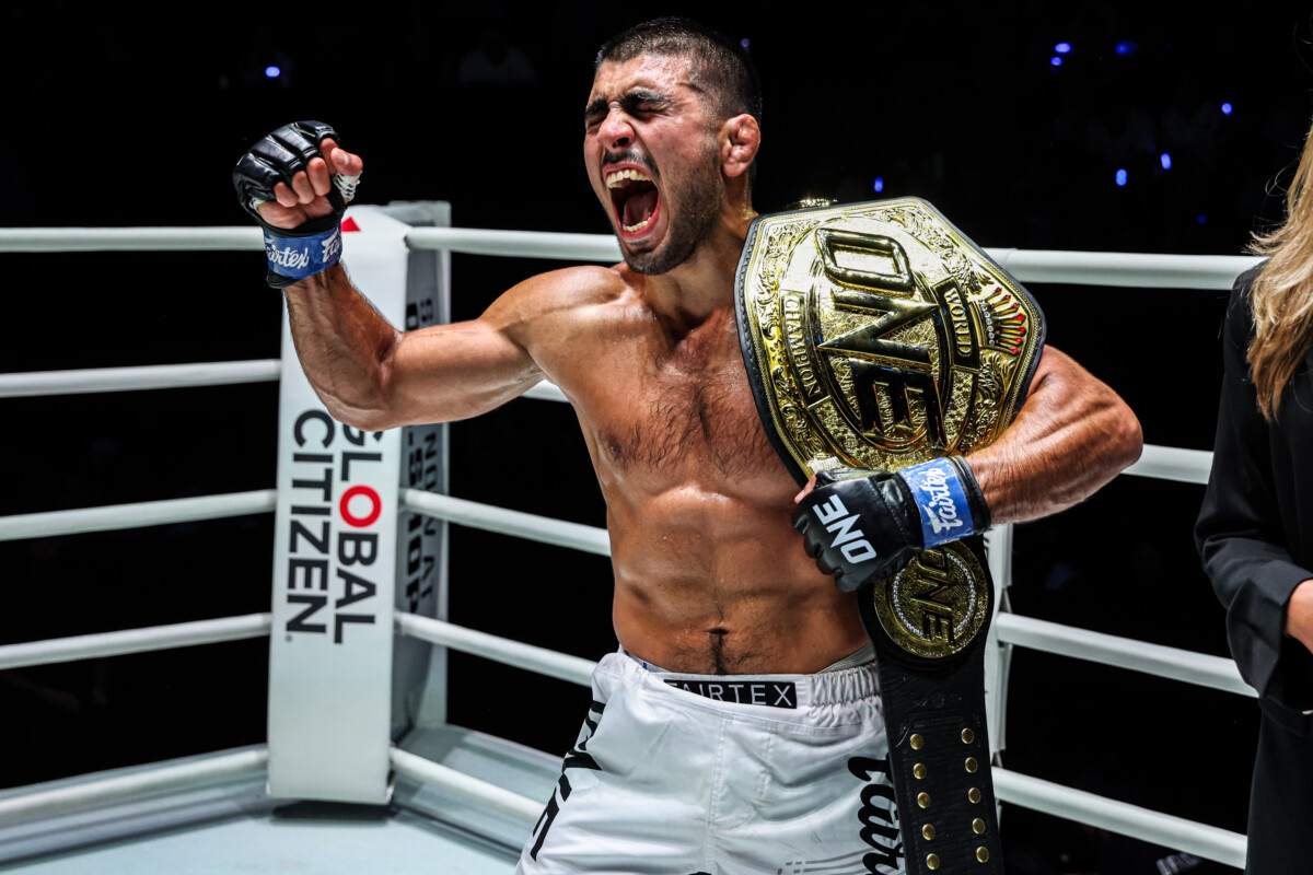 Elbek Alyshov celebrates after capturing the ONE Bantamweight MMA World Championship at The Inner Circle 24
