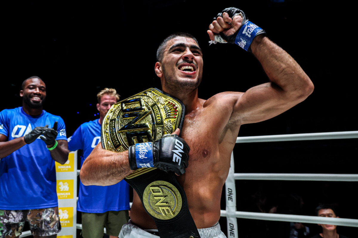 Elbek Alyshov celebrates after capturing the ONE Bantamweight MMA World Championship at The Inner Circle 24