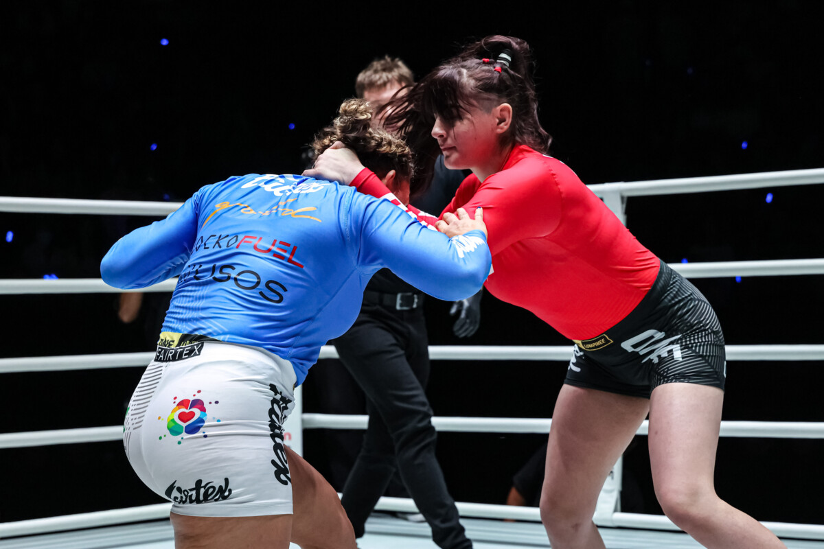 Helena Crevar grabs Paige Ivette Clymer's neck at The Inner Circle 22