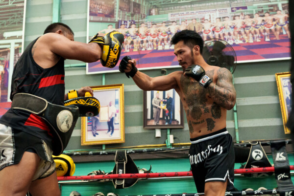 Suakim Pongsuphan PK fires a punch into the pads during The Inner Circle 25 open workout