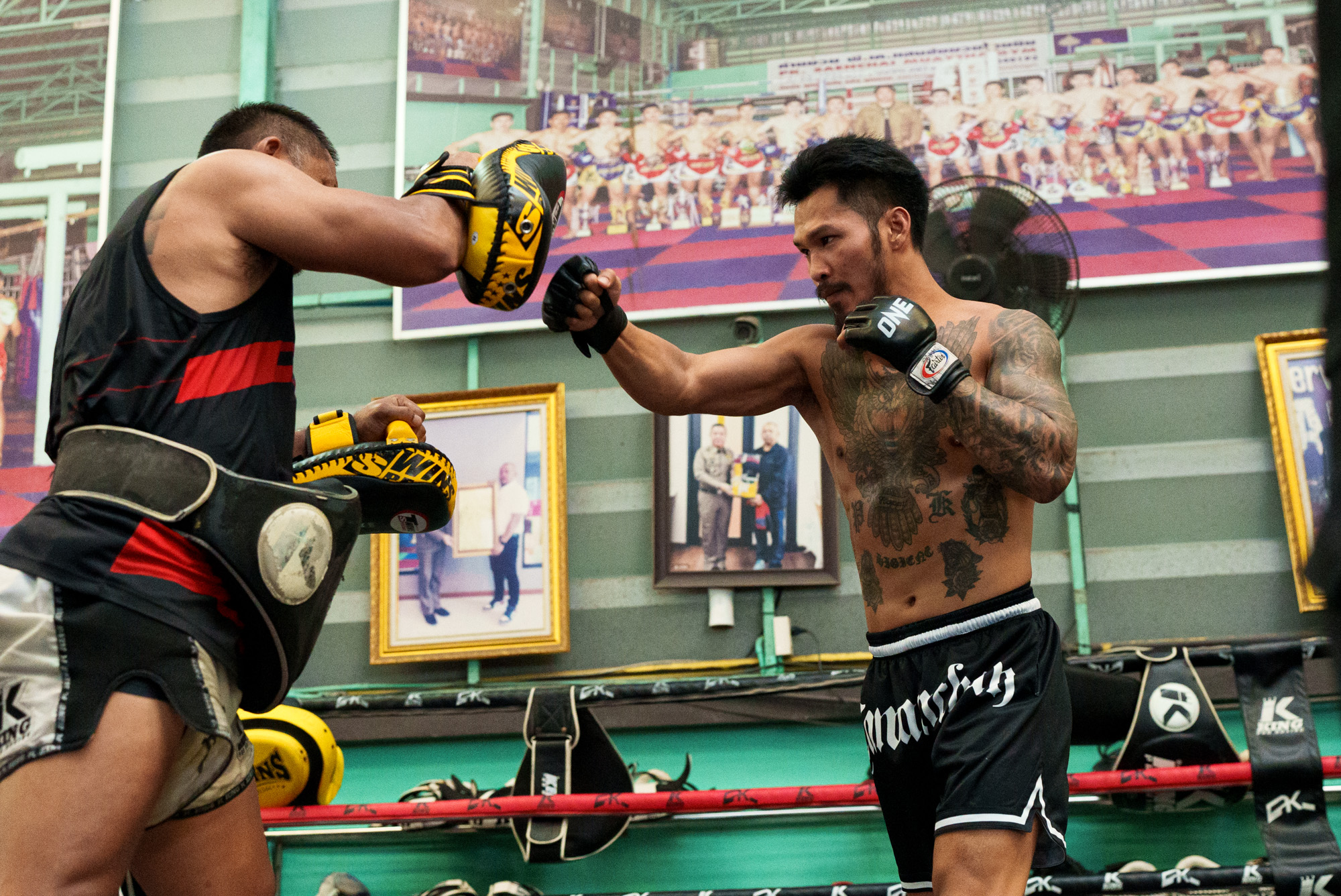 Suakim Pongsuphan PK fires a punch into the pads during The Inner Circle 25 open workout