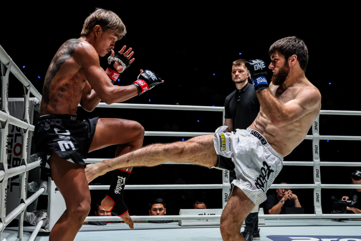 Suksawat absorbs a leg kick from Ilyas Musaev at ONE Friday Fights 165.