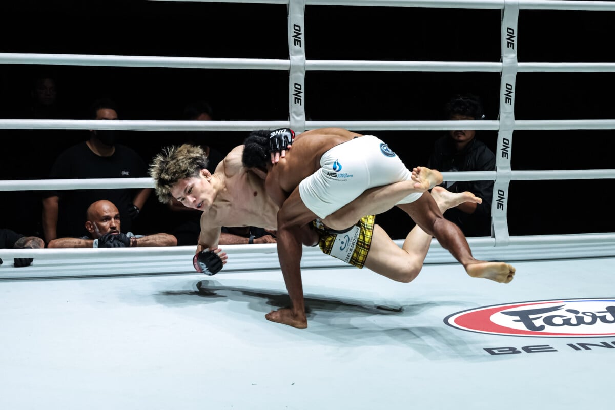 Fabio Henrique secures a takedown against Ryohei Kurosawa at ONE Fight Night 47