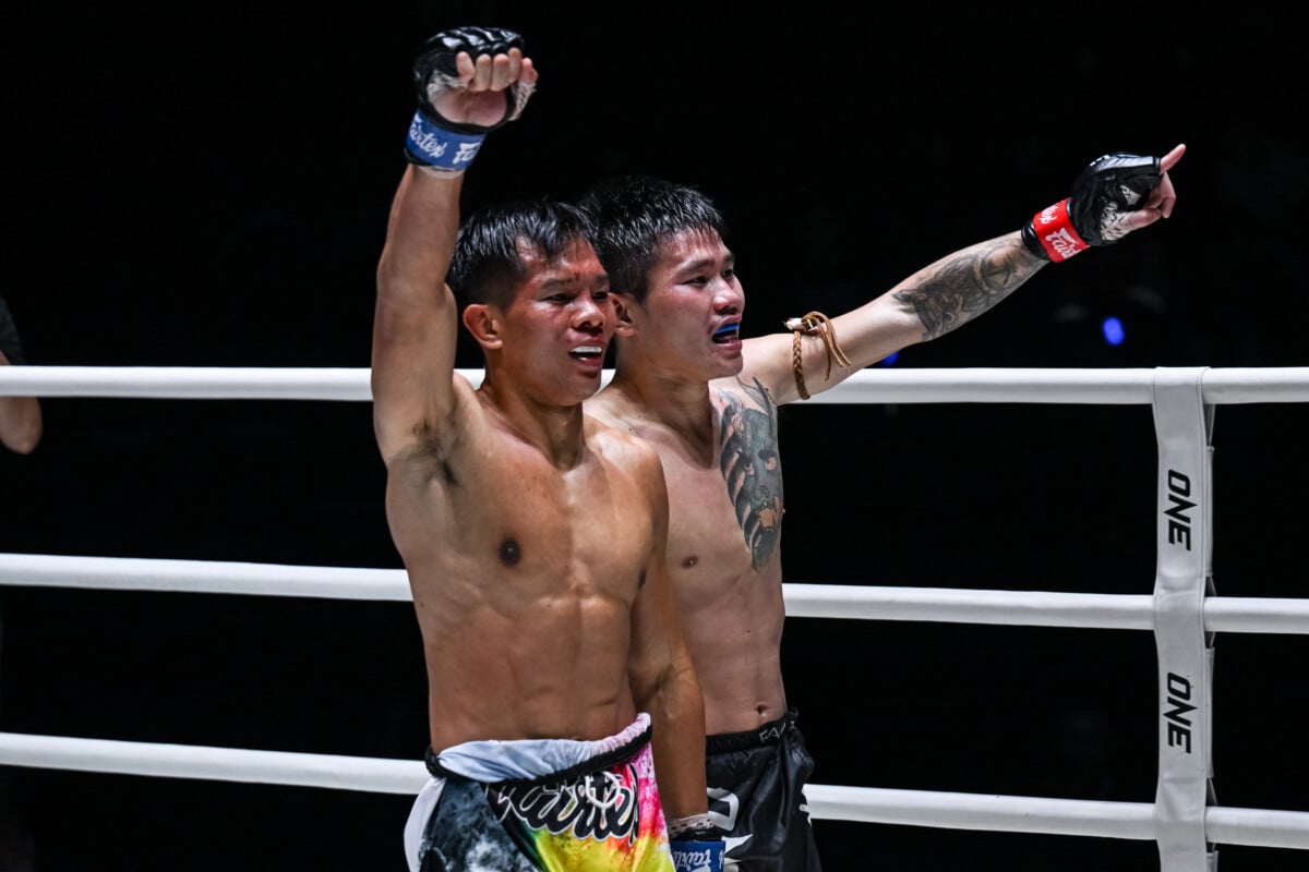 Klarob and Sornsueknoi celebrates with the fans after their war at ONE Friday Fights 171.