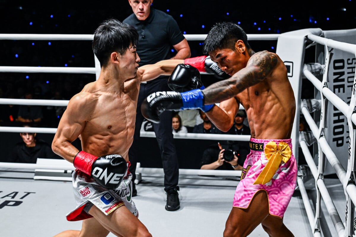 Nadaka Yoshinari punches Har Ling Om in the head
