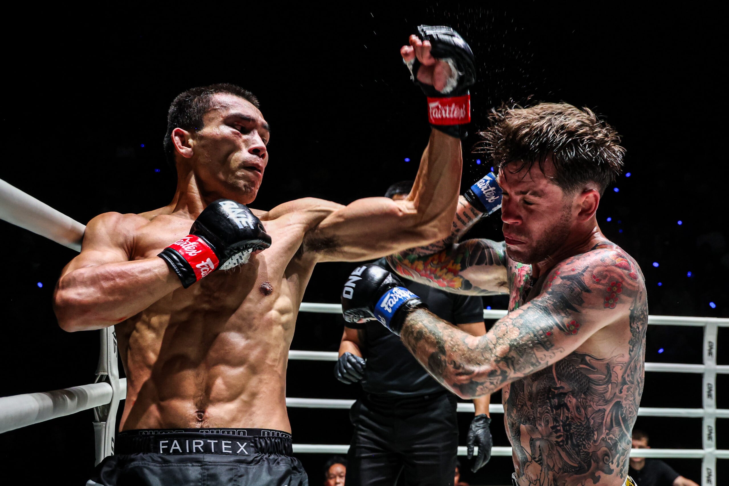 Petmuangsri counters with a left elbow against Gregor Thom at The Inner Circle 29.