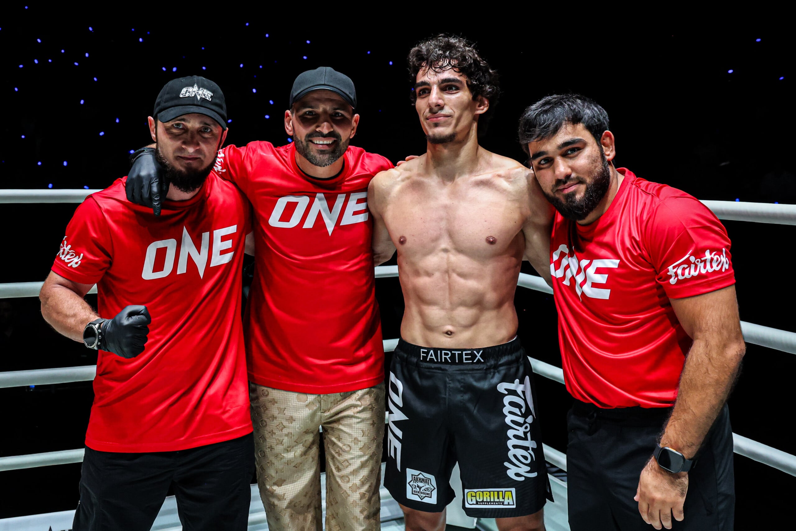 Dzhamil Osmanov celebrates with his team after defeating Ben Woolliss at The Inner Circle 33.