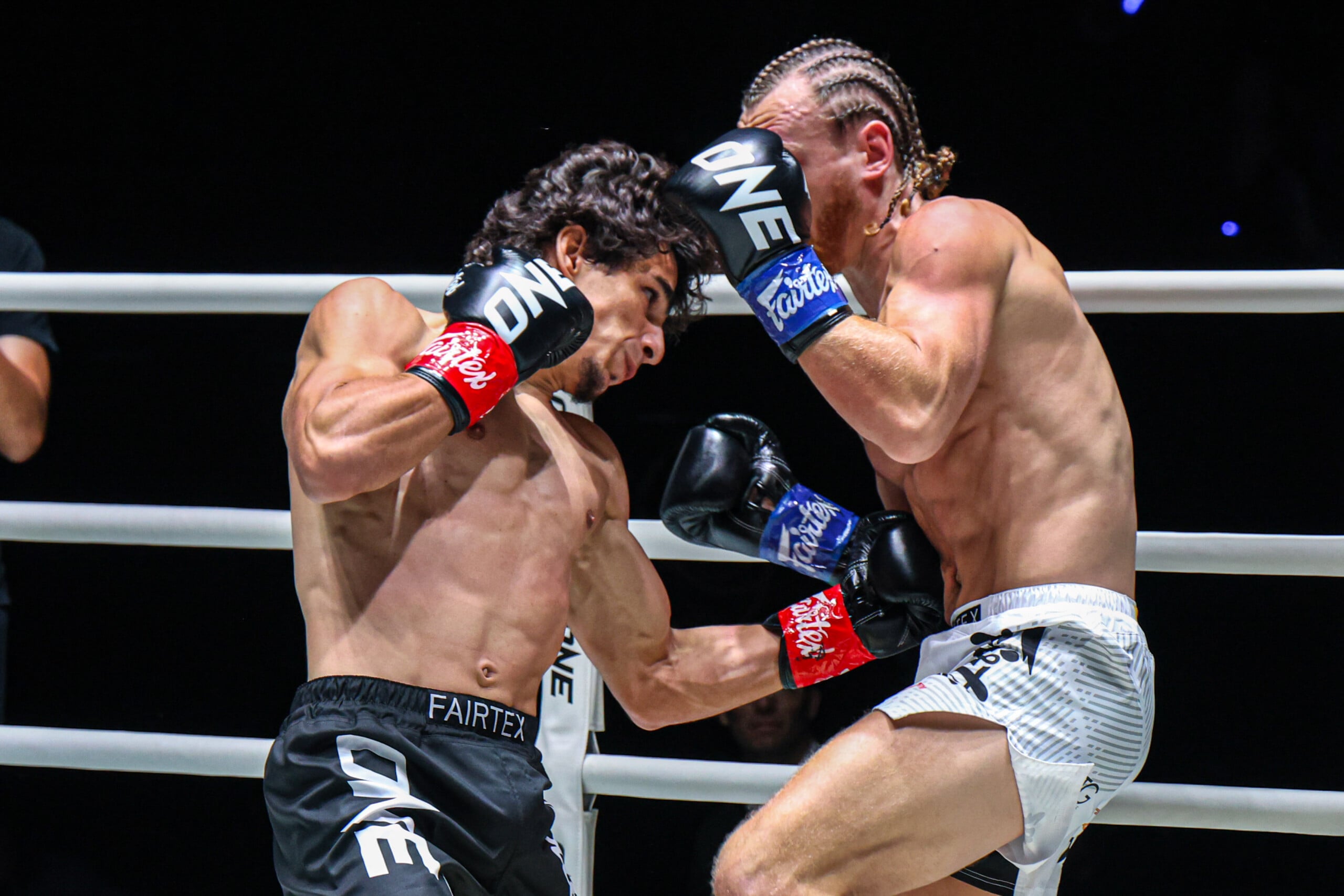 Dzhamil Osmanov lands a body shot on Ben Woolliss at The Inner Circle 33.