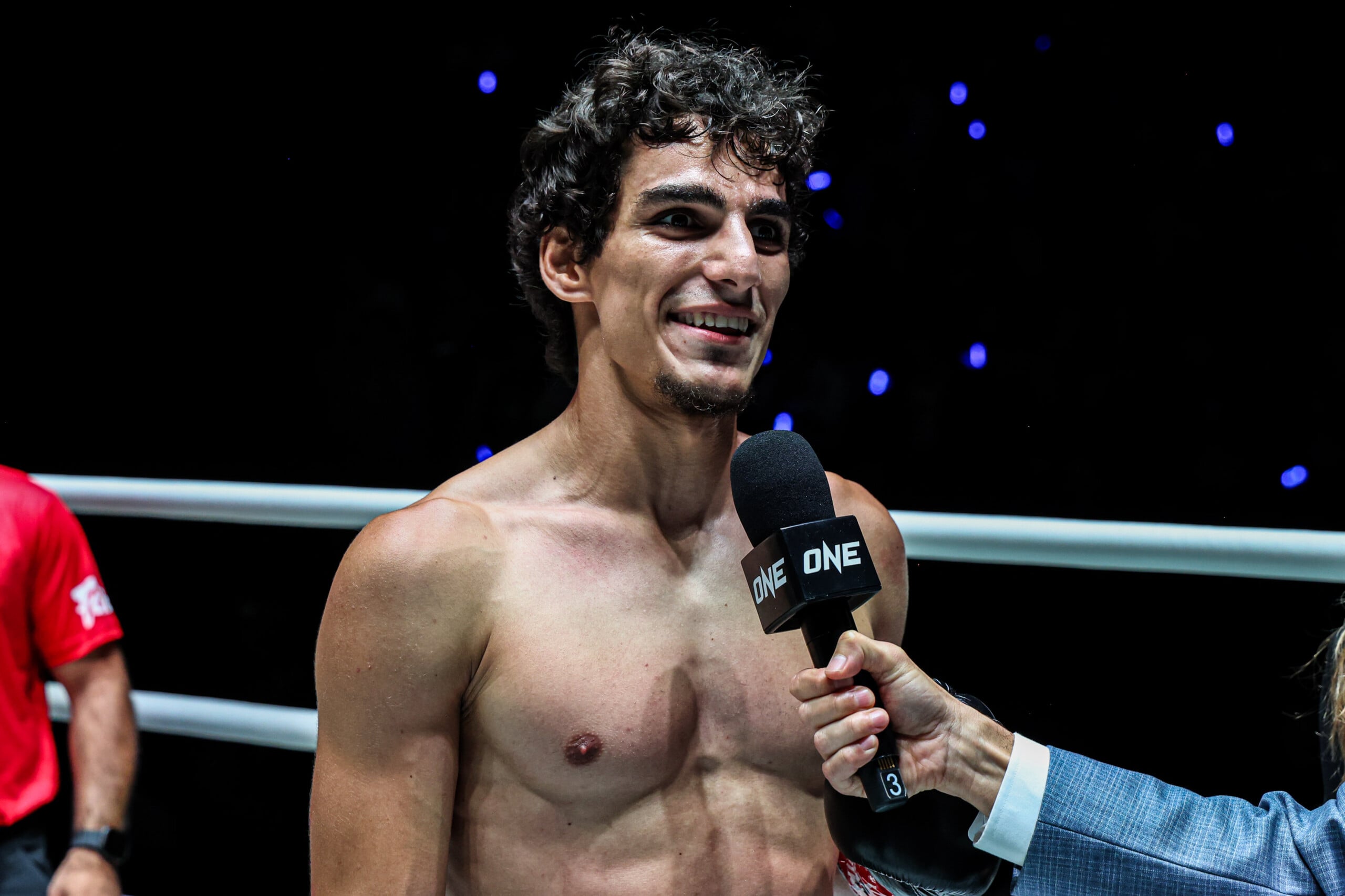 Dzhamil Osmanov speaks inside the ring after defeating Ben Woolliss at The Inner Circle 33.
