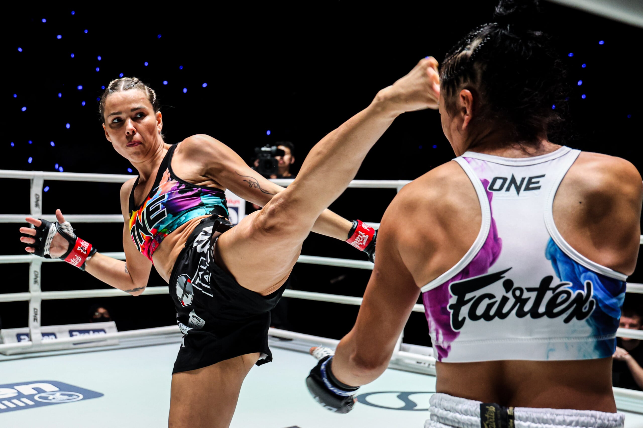Mia Trevorrow throws a high kick on Sheila Barrios at The Inner Circle 33.