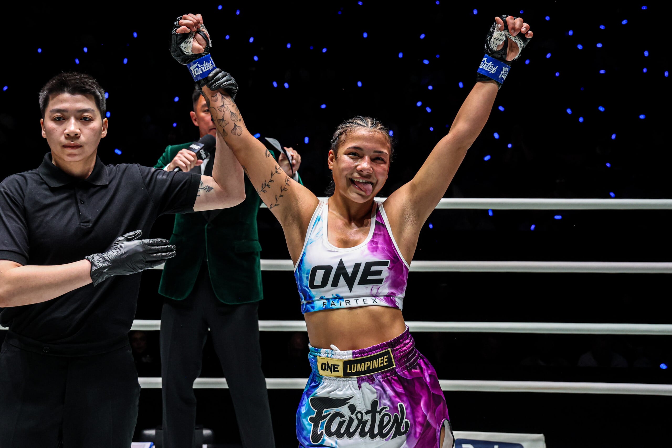Sheila Barrios gets her hands raised at The Inner Circle 33.