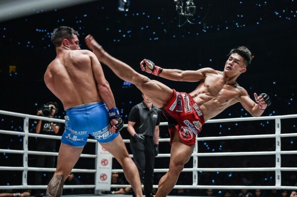 Reece McLaren narrowly evades Danny Kingad's high kick attempt at ONE: DAWN OF HEROES in Manila.