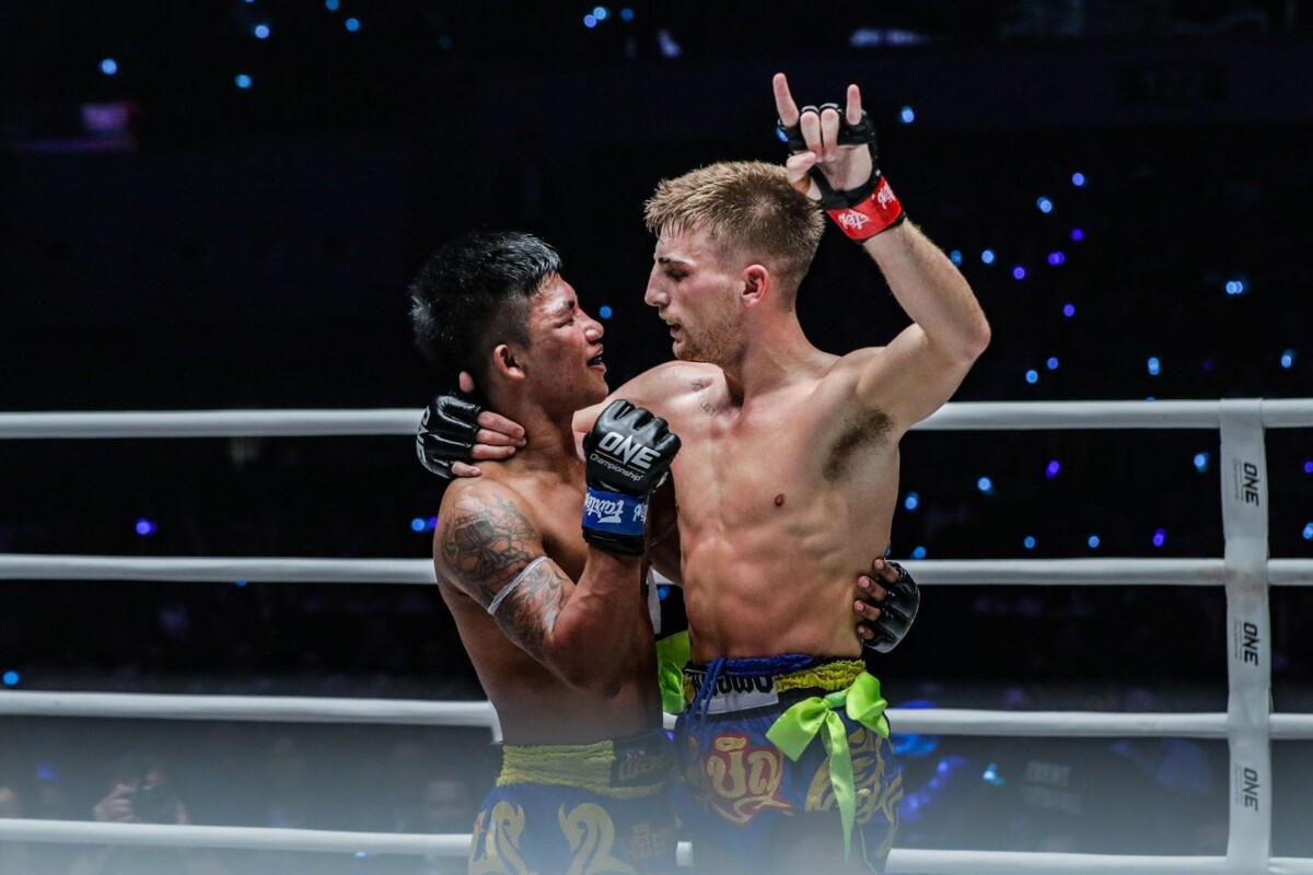 Jonathan Haggerty and Rodtang Jitmuangnon embrace after their ONE Flyweight Muay Thai World Title bout in Manila.
