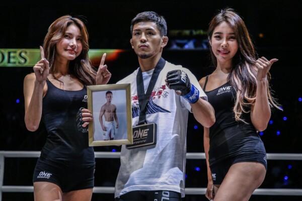 Japanese martial artist Yuya Wakamatsu celebrates his win with the ring girls in Manila