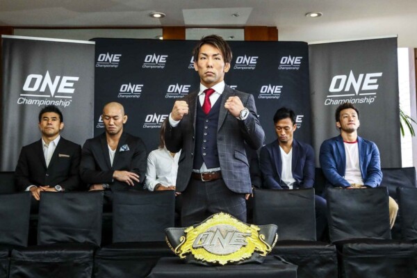 Yosuke "The Ninja" Saruta with the ONe Championship belt at the ONE CENTURY media day