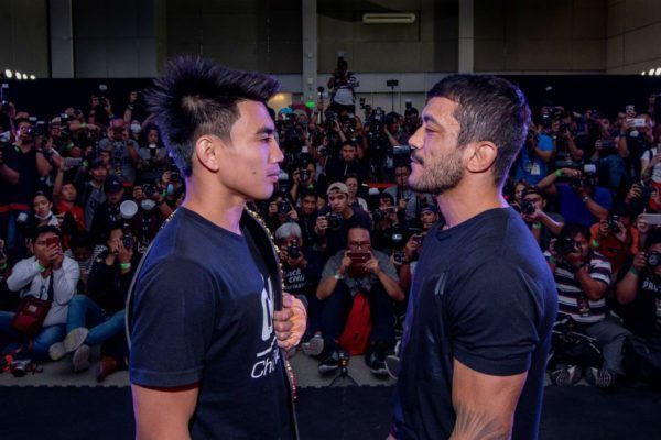 ONE Strawweight World Champion Joshua Pacio faces off with Alex Silva at the ONE: FIRE & FURY Press Conference