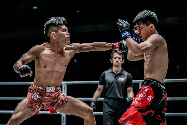 Indonesian mixed martial artist Adrian Mattheis lunges forward with a jab