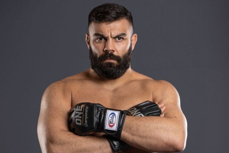 Amir Aliakbari pose arms crossed 1200X800 768x512