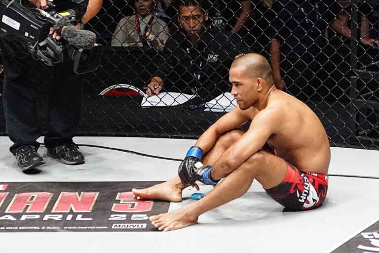 Philippine mixed martial artist Rene Catalan sitting down in the cage