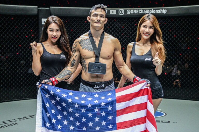 Vietnamese-American Thanh Le raises the stars and stripes following his knockout of Kotetsu Boku