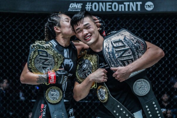 Angela Lee and Christian Lee with their ONE Championship belts at ONE: CENTURY