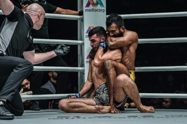 Rahul Raju locks in the rear-naked choke