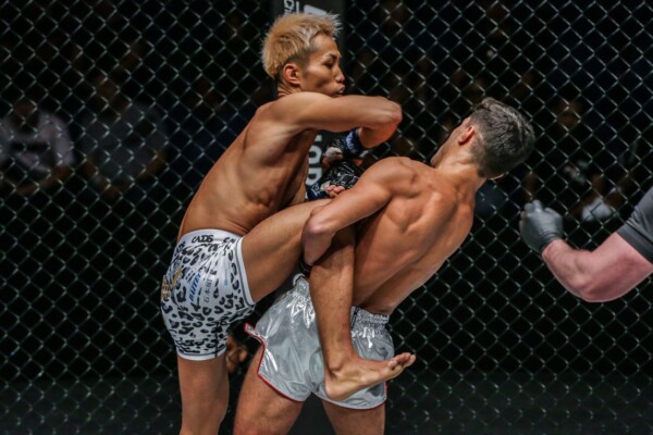 Japan's Taiki Naito goes for an elbow, but Rui Botelho goes for the sweep