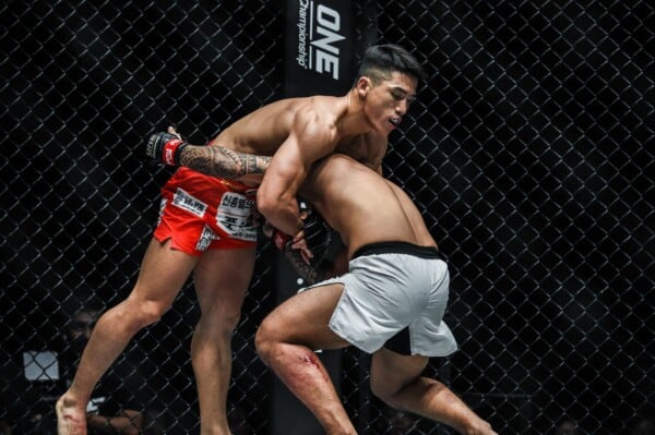 South Korean Yoon Chang Min grabs a headlock