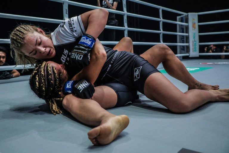 Japanese rising star Itsuki Hirata takes a scarf hold position against Nyrene Crowley in February 2020