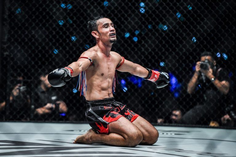 ONE Strawweight Kickboxing World Champion Sam-A Gaiyanghadao celebrates his win against Wang Junguang