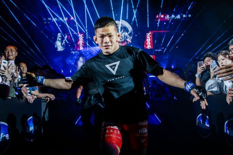 Japanese mixed martial artist Shuya Kamikubo enters the arena