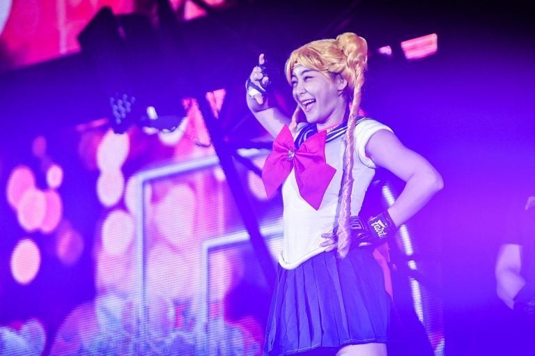 Thai mixed martial artist Rika Ishige greets the crowd as sailor moon