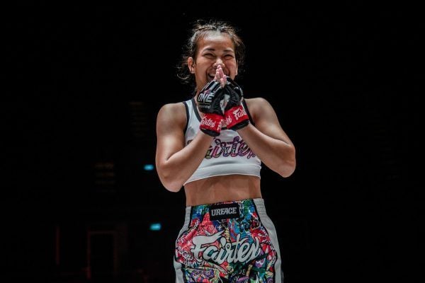 Muay Thai fighter Wondergirl Fairtex holds her hands together following her debut victory