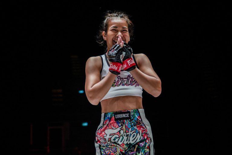 Muay Thai fighter Wondergirl Fairtex holds her hands together following her debut victory