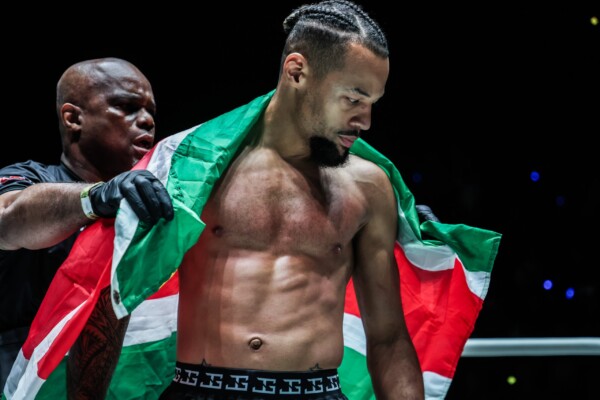 Regian Eersel poses with the Suriname flag against George Jarvis at ONE Fight Night 34
