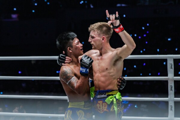 Jonathan Haggerty and Rodtang Jitmuangnon embrace after their ONE Flyweight Muay Thai World Title bout in Manila.