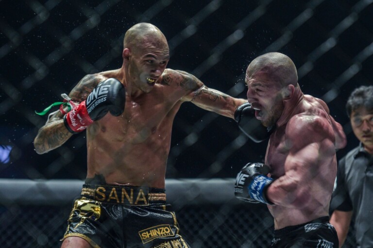 Samy Sany connects with a left hook on Dzhabar Askerov