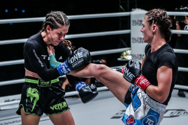 Britain's Amber Kitchen pushes Slovakia's Viktoria Lipianska back with a teep