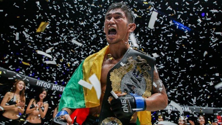 Aung La N Sang celebrates a triumphant victory.