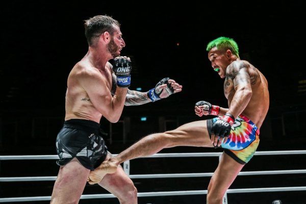 Thai mixed martial arts star Yodkaikaew Fairtex lands a leg kick on Alex Schild