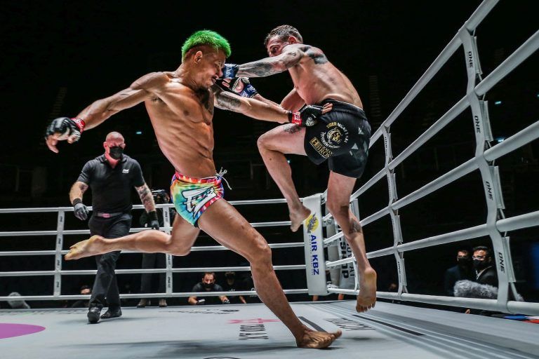 Thai mixed martial artist Yodkaikaew Fairtex kicks his rival's legs