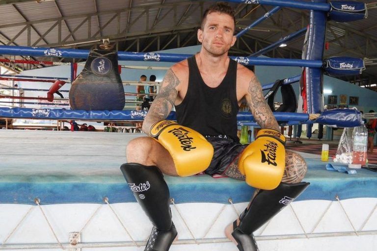 Irish Muay Thai World Champion Sean Clancy sits on the edge of the ring