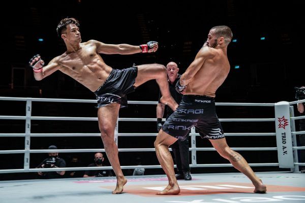 Thai mixed martial artist Shannon Wiratchai goes for a kick on Fabio Pinca