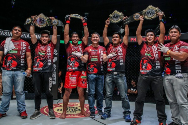 Team Lakay members posing with their belts