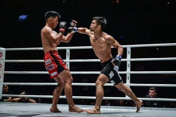 Japanese rising martial arts star throws a cross at former ONE Flyweight World Champion Geje Eustaquio