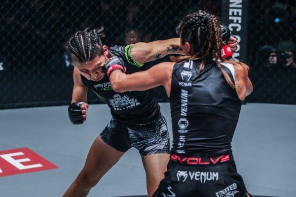 Singapore's Angela Lee strikes with China's Xiong Jing Nan in their second bout at ONE: CENTURY PART I in October 2019