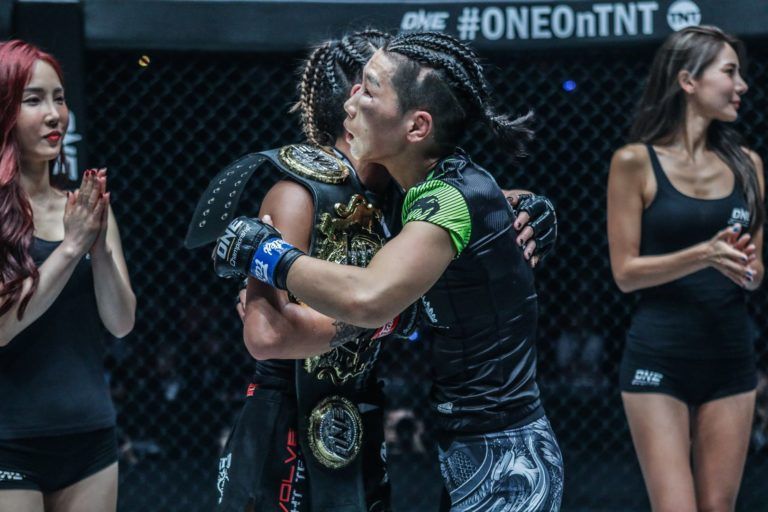 The two women's mixed martial arts champions of ONE Championship embrace after their rematch