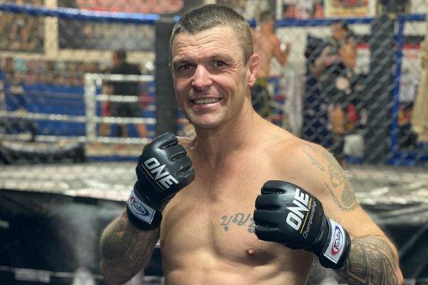 10-time Kickboxing and Muay Thai World Champion John Wayne Parr poses in his ONE Championship gloves