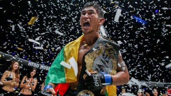 Aung La N Sang celebrates a triumphant victory.