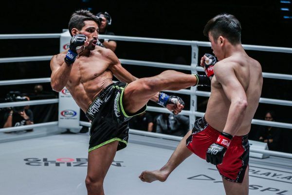 French-Algerian star Mehdi Zatout hits Chinese striker Han Zi Hao with a roundhouse kick